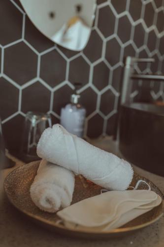a piece of food sitting on a plate with a towel at Amalú Luxury View Cabins in Monteverde Costa Rica