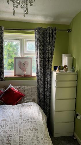 a bedroom with a bed and a window at 6 badger way in Hatfield