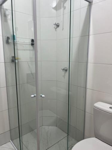 a glass shower in a bathroom with a toilet at Apto novo! Recém entregue in Cabedelo
