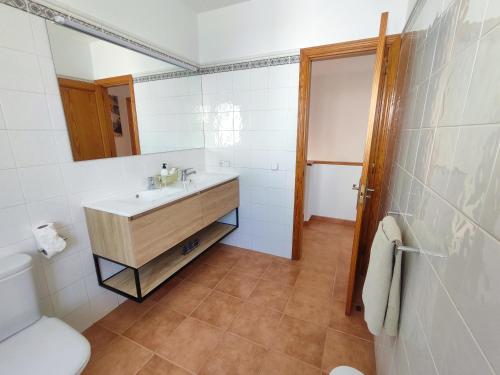 a bathroom with a sink and a toilet at Villa Valperal, en Lanzarote in Playa Blanca