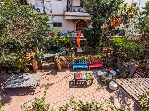 an aerial view of a garden with plants and furniture at Jaat House in Bhuj