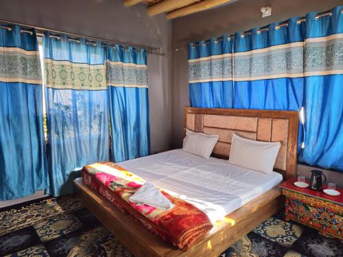 Postel nebo postele na pokoji v ubytování PASANG HOMESTAY