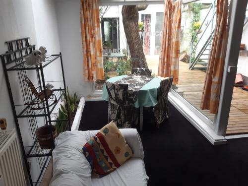 a living room with a table and a couch at CASA DI MARCO in Antwerp