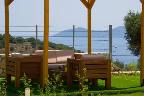 a patio with a view of the water at Kefalonia Horizon Villas in Ayia Evfimia