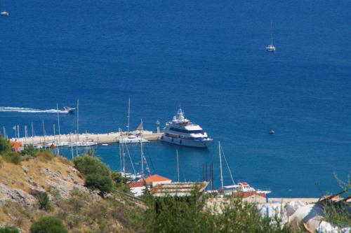 a cruise ship is docked in a harbor at Kefalonia Horizon Villas in Ayia Evfimia