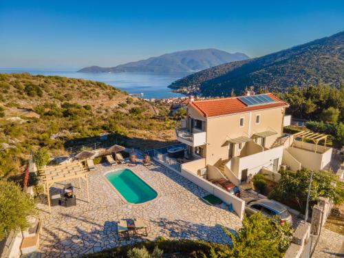 an aerial view of a house with a swimming pool at Kefalonia Horizon Villas in Ayia Evfimia