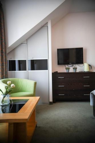 Μια τηλεόραση ή/και κέντρο ψυχαγωγίας στο Apartamenty przy plaży - Willa For You