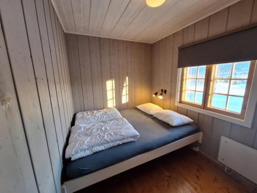 a small room with a bed in a wall at Øen cabin in Geilo by Norgesbooking in Geilo