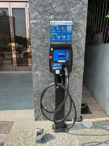 a parking meter sitting next to a building at 星澄風旅 Zela Design Hotel in Kaohsiung