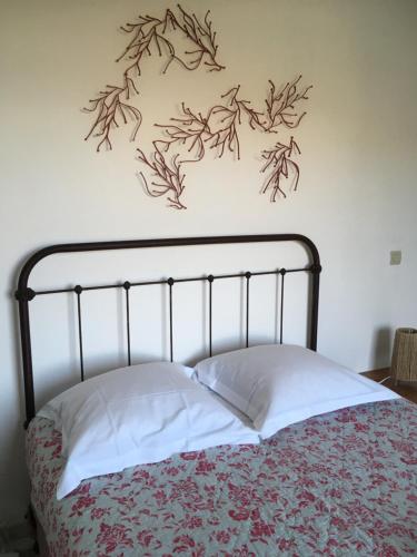 Ένα ή περισσότερα κρεβάτια σε δωμάτιο στο La salamandre Vue exceptionnelle calanche Piana