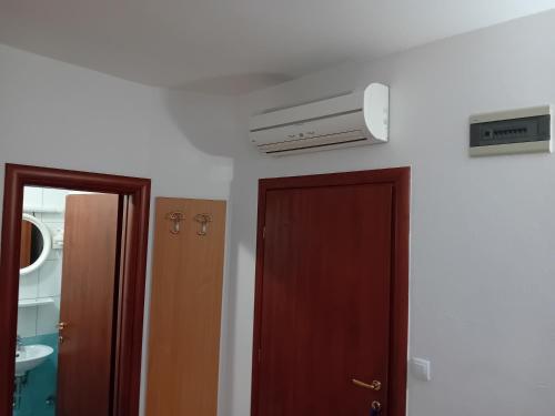 a room with a door and a air conditioner at Vila Centar in Trebinje