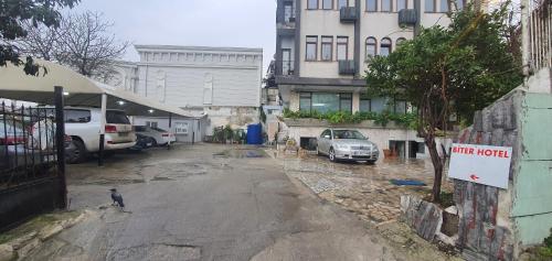 an empty parking lot with cars parked next to buildings at Biter Hotel in Istanbul