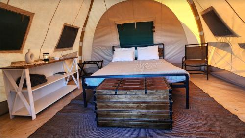 a bedroom with a bed in a dome tent at Kestrel in Valle