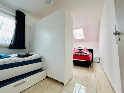מיטה או מיטות בחדר ב-Ferienwohnung Familie Sobierajczyk - Fewo unweit Ostsee