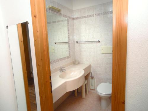 a bathroom with a sink and a toilet at Hostel San Matteo in Santa Caterina Valfurva