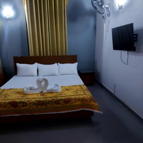 Säng eller sängar i ett rum på Orina Hotel