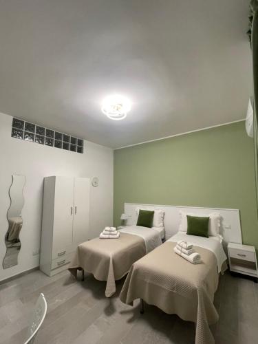 Ένα ή περισσότερα κρεβάτια σε δωμάτιο στο L'Ulivo