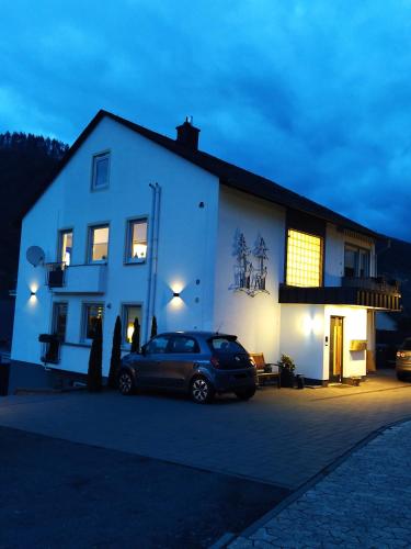 a car parked in front of a white building at Kleine Auszeit in Cochem