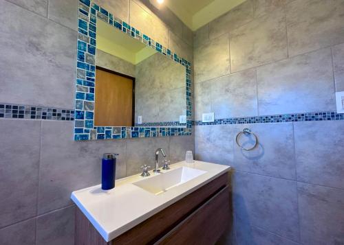 a bathroom with a sink and a mirror at Complejo La Dorada in Merlo