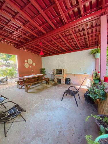 a living room with a ping pong table and chairs at Espaço Monjolo in Barra do Garças