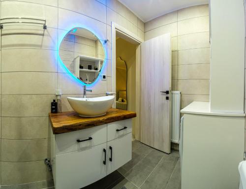 a bathroom with a sink and a mirror at Armonia Holiday Home Corfu with King size Bed and Private Garden in Áyios Pandeleḯmon