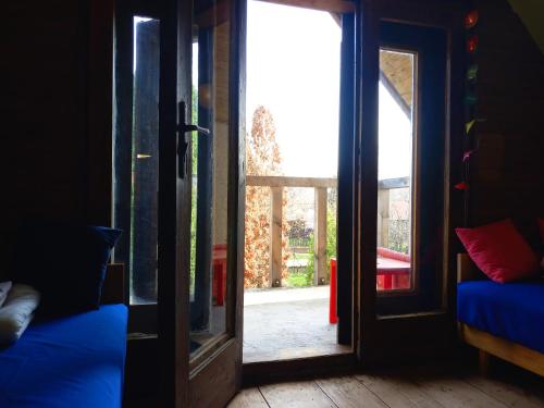 an open door to a room with a window at Kisfaludy Apartment House in Gárdony