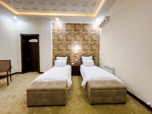 Katil atau katil-katil dalam bilik di Hotel Marakanda
