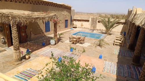 an aerial view of a house with a swimming pool at kasbah luna del sur in Erfoud