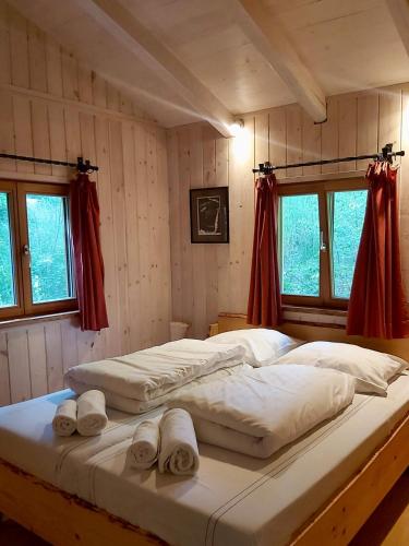 a bedroom with two beds with towels on them at Dengler Hof in Hohenberg an der Eger