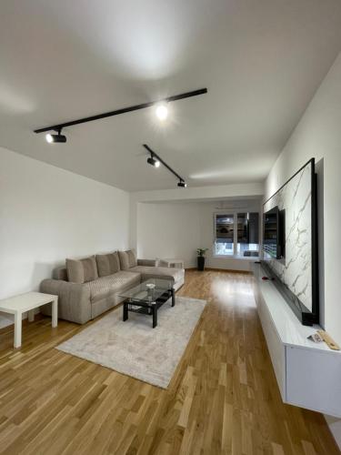a living room with a couch and a table at Diamond Apartment in Strumica