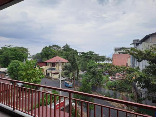 a balcony with a view of a street at BahuBay Hotel Manado in Malalayang