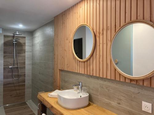 a bathroom with a sink and a mirror at Casa Santa Giulia in Propriano