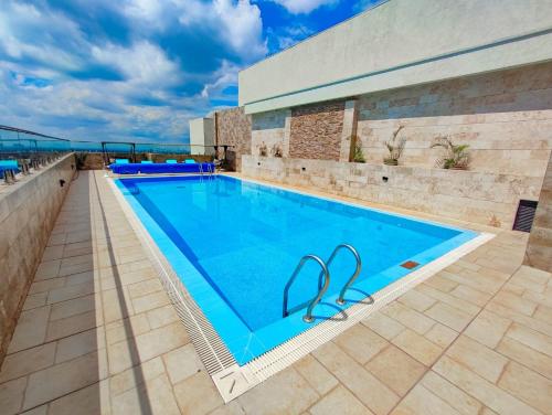 a large swimming pool on top of a building at Oakley Apartment- By Tito Homes in Nairobi