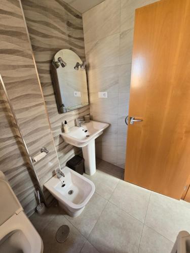 a bathroom with a sink and a toilet at Duplex 6 Mar de Plata in Puerto de Mazarrón