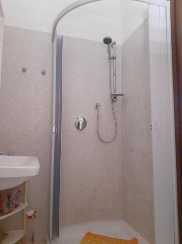 a shower in a bathroom with a sink at La casa di Lina in Milena