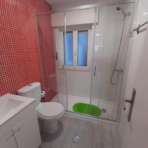 a bathroom with a shower with a toilet and a sink at Casas da Escola - "Casa da Professora" - Meãs in Pampilhosa da Serra