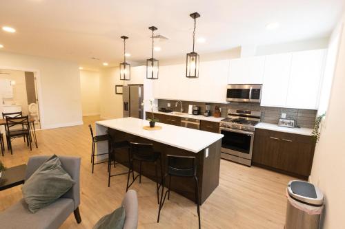 a kitchen with a island in the middle of a room at Spacious 3-BR Luxury Suite near New York City in Union City