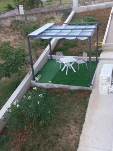 an overhead view of a patio with a table and chairs at lastva 1&2 in Sveti Filip i Jakov