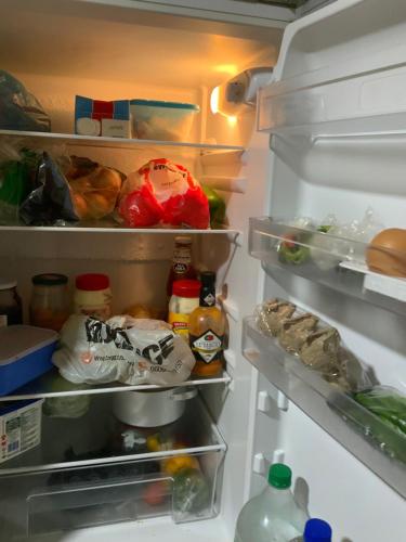 an open refrigerator filled with lots of food at Feel Home in Pretoria