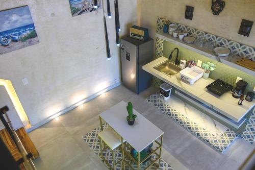 an overhead view of a kitchen with a sink and a table at Departamento Dakota in Chetumal