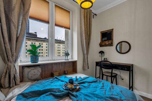 a bedroom with a bed in front of a window at Warsaw New Town - Top Location, Park & Subway Nearby by Rentujemy in Warsaw