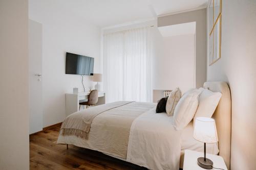 Postel nebo postele na pokoji v ubytování Alatea Apartments Poloni
