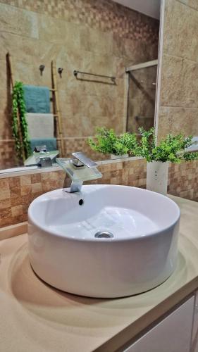 a white sink on a counter in a bathroom at Villas Luins in Chiclana de la Frontera