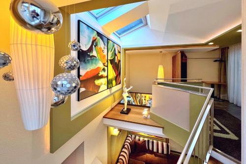 a room with a desk and a painting on the wall at Grütter Luxury Apartments in Ischgl