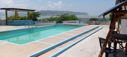 a swimming pool with a view of the water at Casa Montemar Hotel-San Vicente in San Vicente