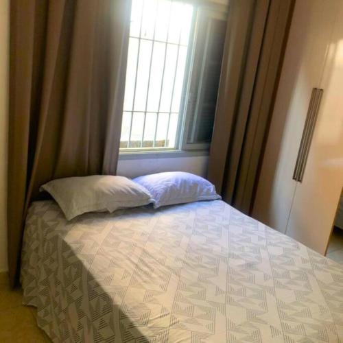 A bed or beds in a room at Recanto Caiçara