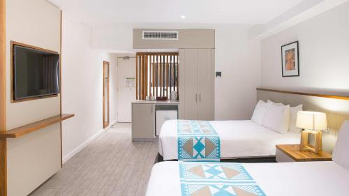 Ένα ή περισσότερα κρεβάτια σε δωμάτιο στο Holiday Inn Suva by IHG