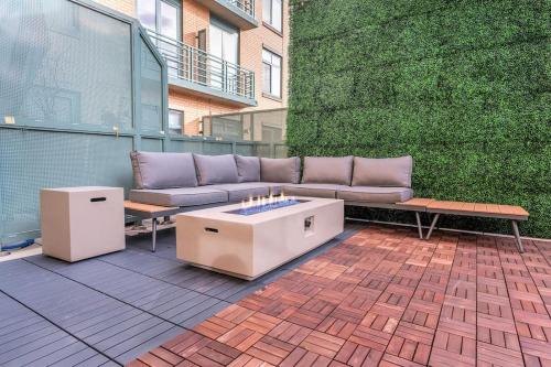 a couch and a coffee table on a patio at Color Splash Pad!! in Arlington
