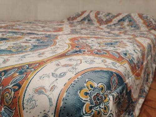 a bedspread with a floral design on it at Oaxaca's treasures in San Felipe del Agua