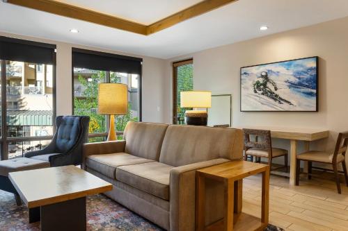 a living room with a couch and a table at Club Wyndham Resort at Avon in Avon